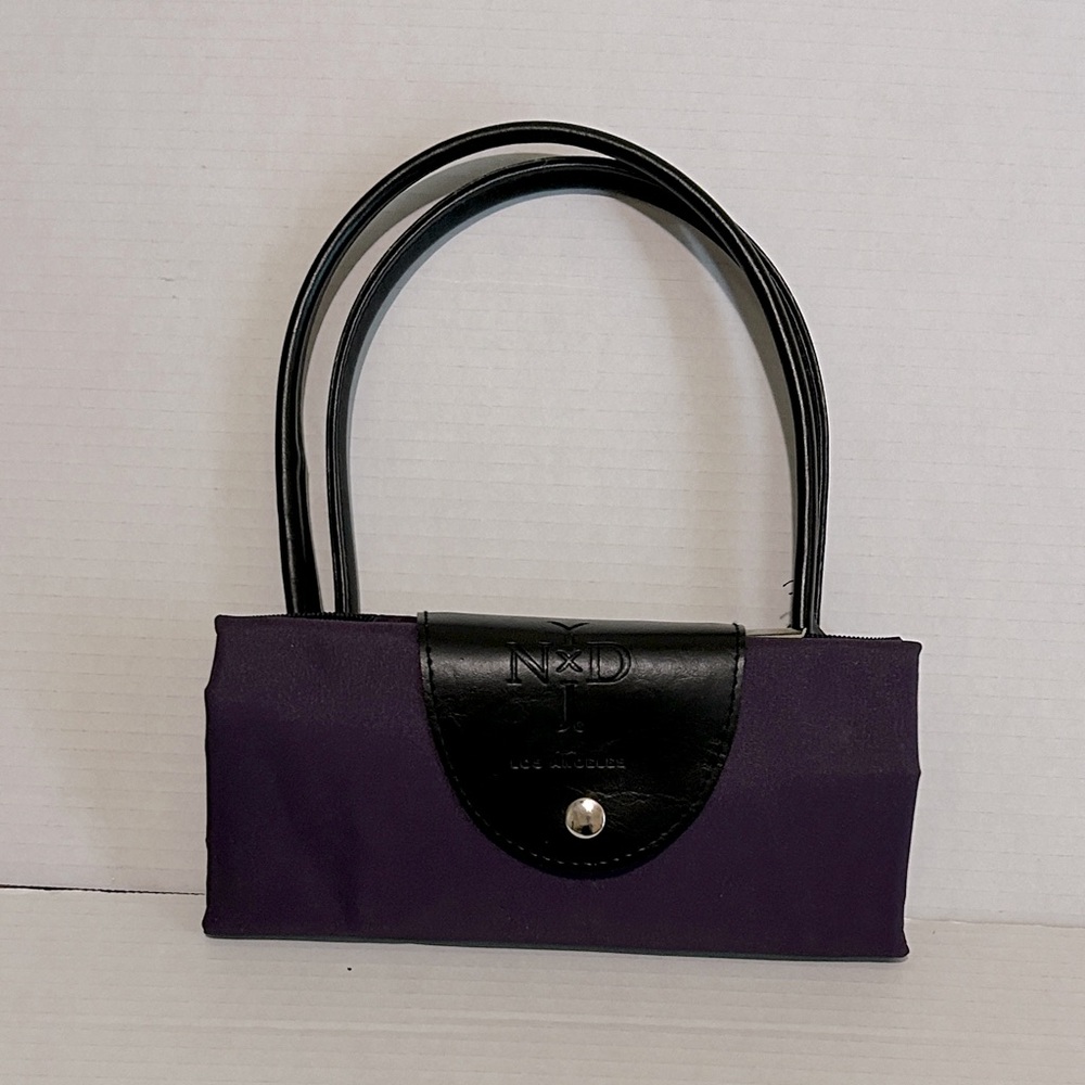 NYDJ Purple and Black foldable zipper tote. Perfect for traveling. Inner pocket